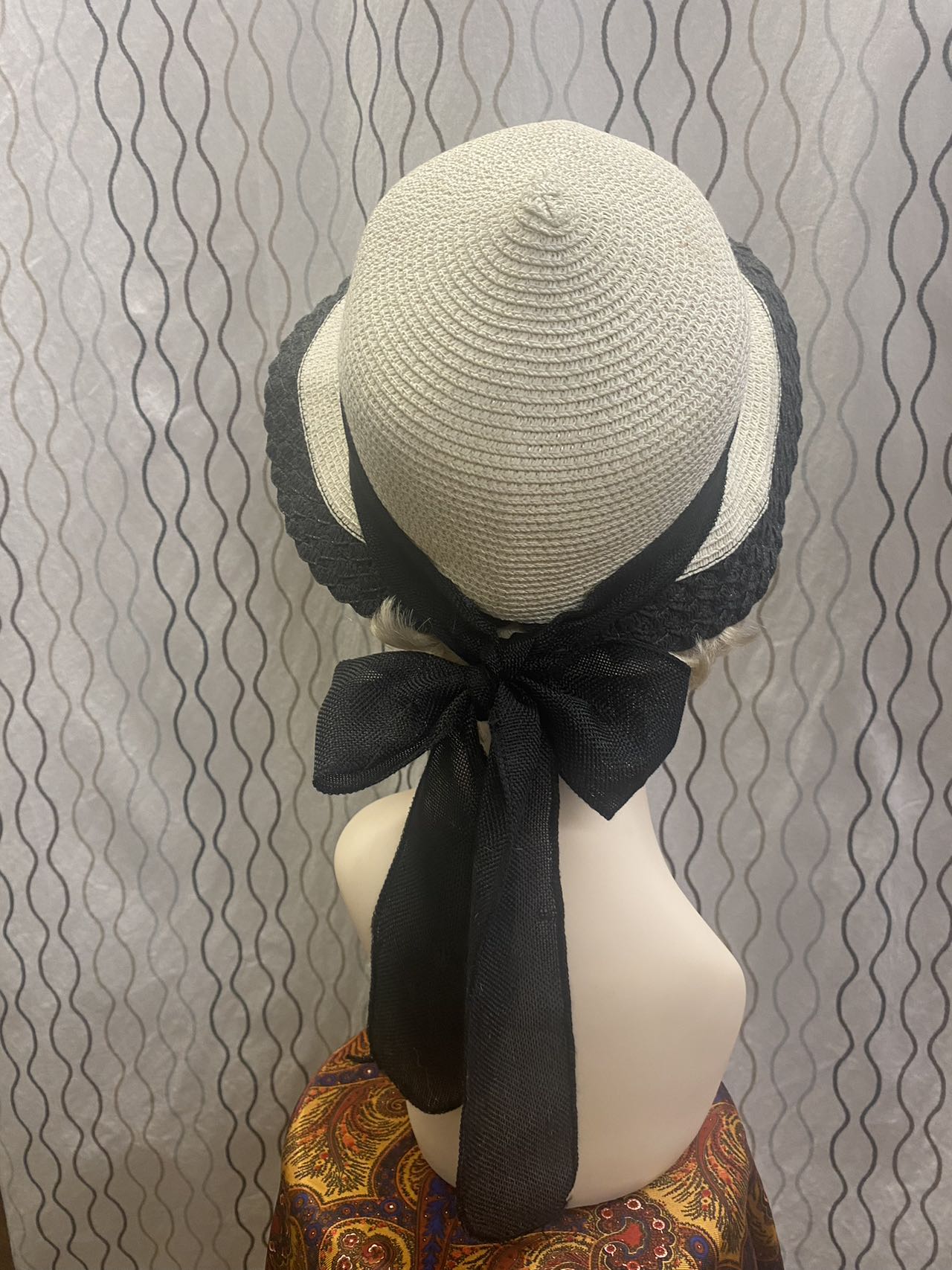 women beige straw sunbonnet with black ribbon