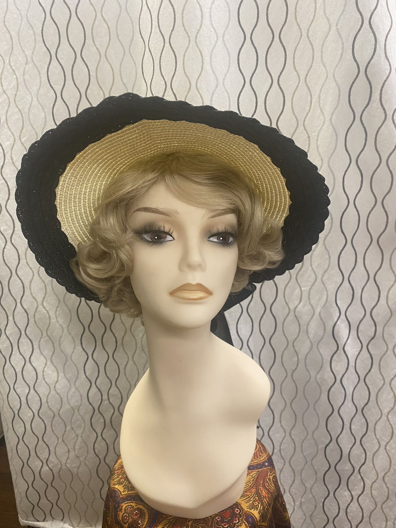 women beige straw sunbonnet with black ribbon